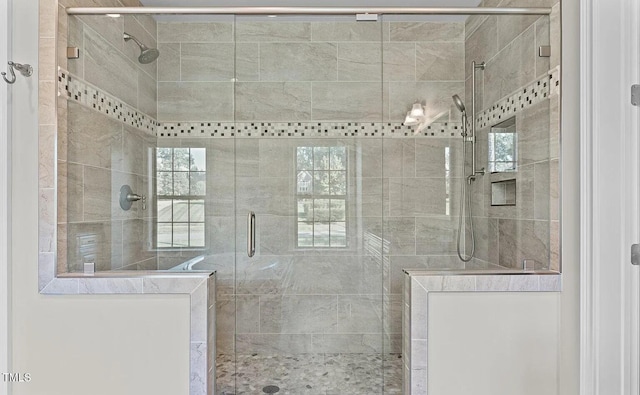 full bath with a shower stall