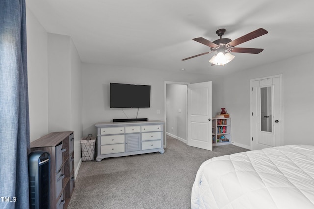 bedroom featuring baseboards, ceiling fan, and carpet