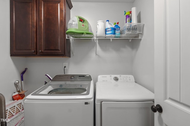 laundry area featuring cabinet space and washer and dryer