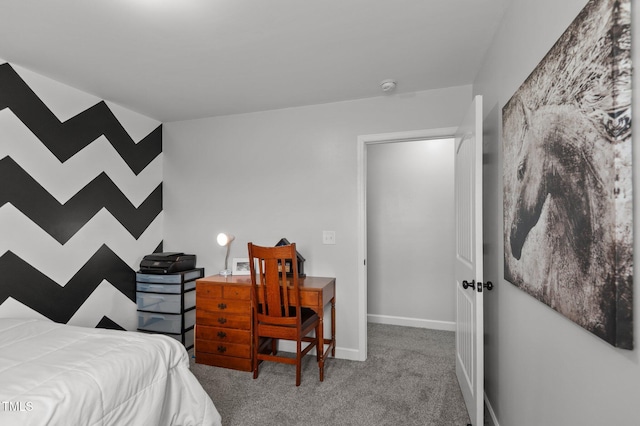 bedroom featuring baseboards and carpet flooring
