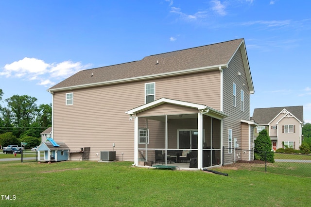 back of property featuring a lawn, fence, a sunroom, and cooling unit