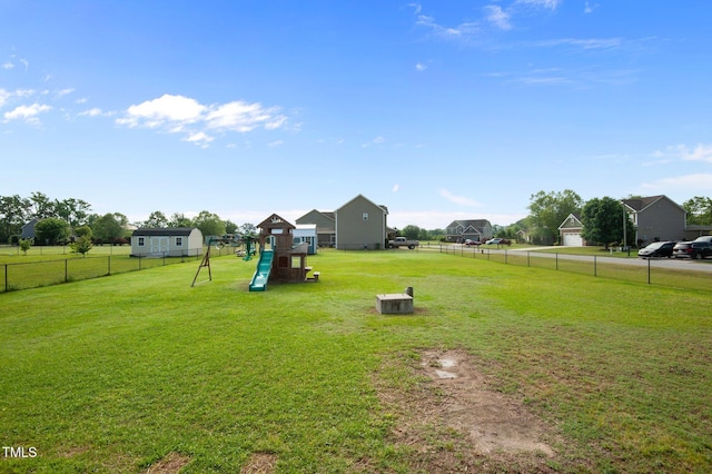 view of yard with a playground and fence