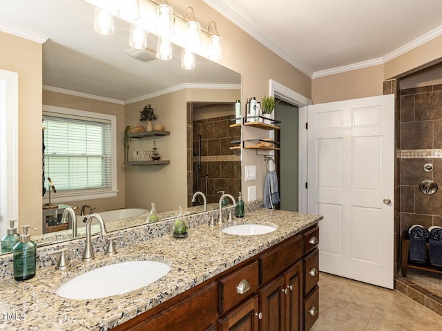 bathroom featuring crown molding, a tile shower, and a sink
