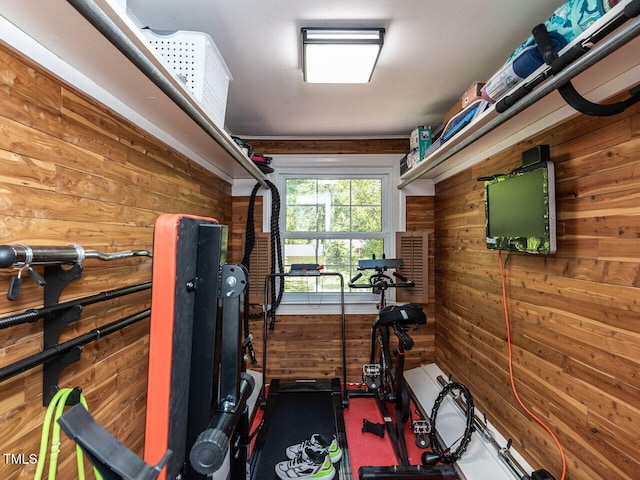 workout area featuring wooden walls