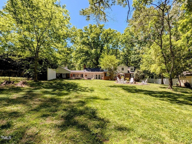 view of yard featuring a patio and fence