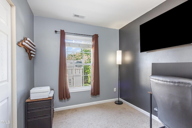 carpeted office featuring baseboards and visible vents