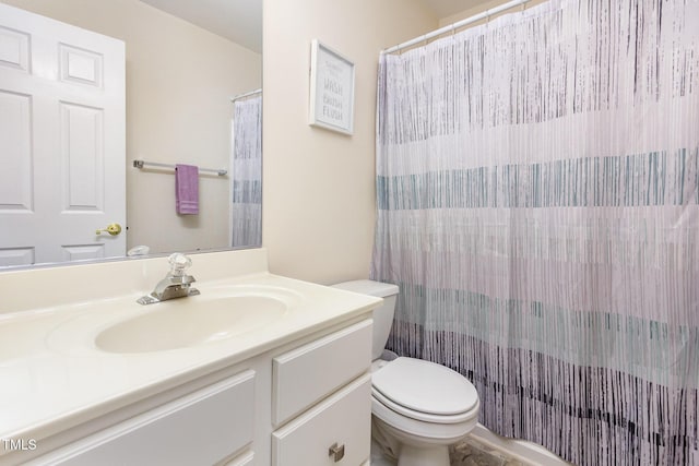 full bathroom with vanity, toilet, and a shower with shower curtain