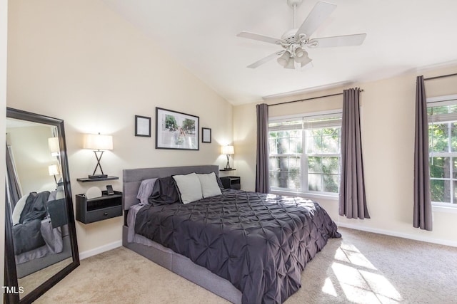 carpeted bedroom featuring baseboards, ceiling fan, and lofted ceiling