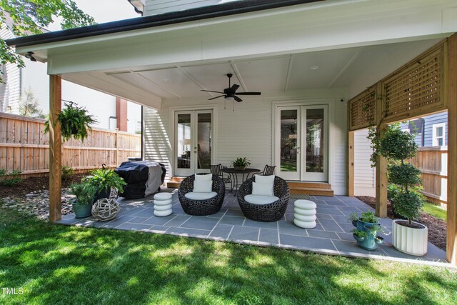 view of patio featuring a ceiling fan, fence, french doors, and a grill