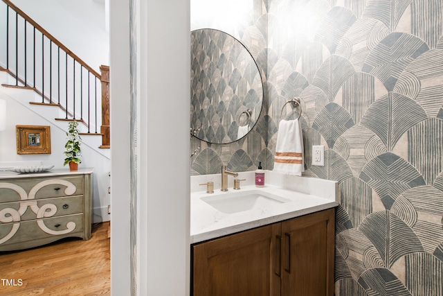 bathroom featuring vanity and wood finished floors