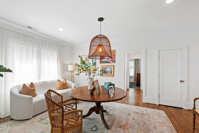 dining space with recessed lighting, visible vents, and wood finished floors