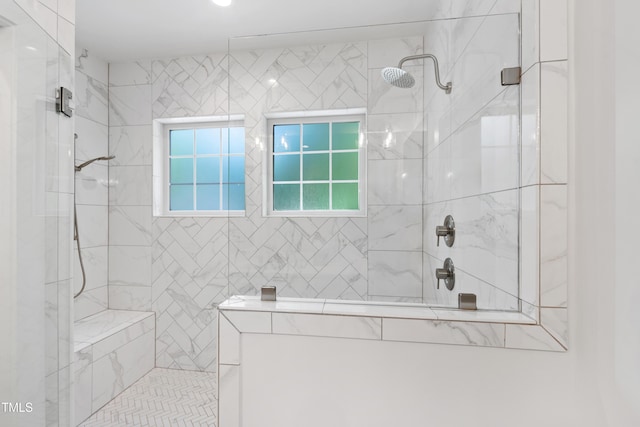 bathroom featuring tiled shower