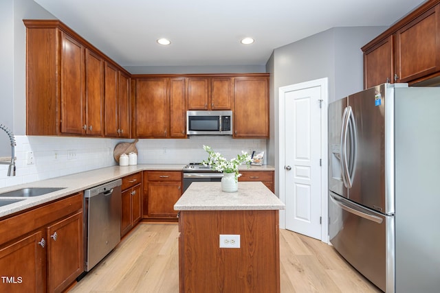 8719 Cypress Grove Run, Raleigh, NC 27612 - kitchen featuring light wood-style floors, tasteful backsplash, a kitchen island, and stainless steel appliances