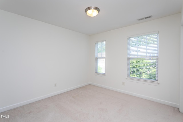 8719 Cypress Grove Run, Raleigh, NC 27612 - unfurnished room featuring visible vents, baseboards, a healthy amount of sunlight, and light carpet