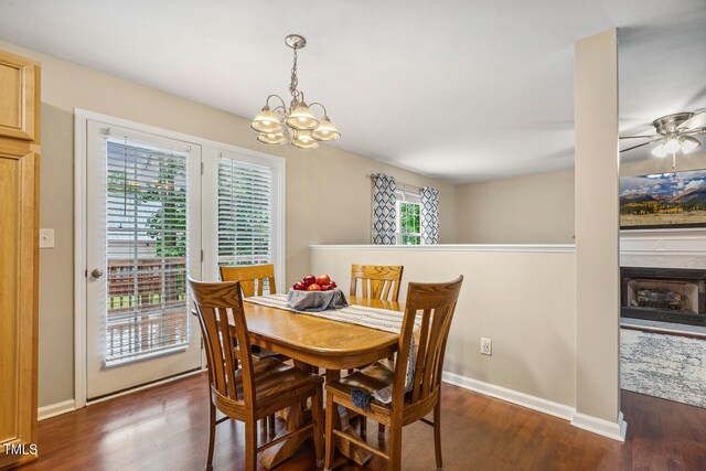 1984 Sadler Ave, Creedmoor, NC 27522 - dining room featuring wood finished floors, a chandelier, ceiling fan, and baseboards