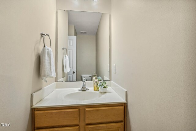 1984 Sadler Ave, Creedmoor, NC 27522 - bathroom featuring vanity and toilet