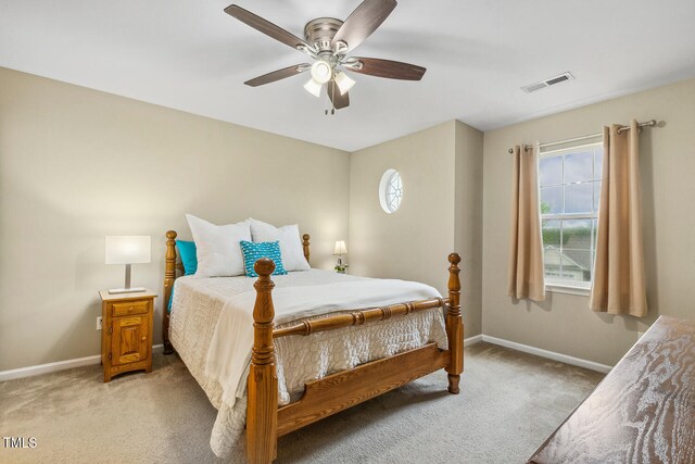 1984 Sadler Ave, Creedmoor, NC 27522 - bedroom with light carpet, baseboards, and ceiling fan