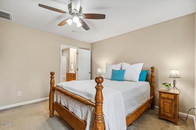 1984 Sadler Ave, Creedmoor, NC 27522 - bedroom with light colored carpet, baseboards, and connected bathroom