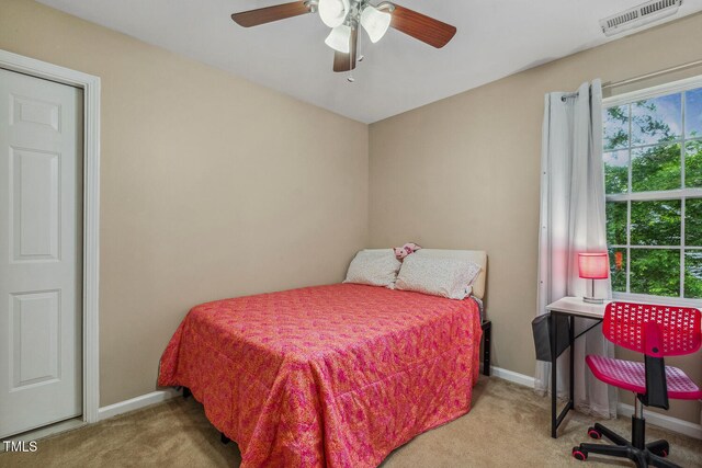 1984 Sadler Ave, Creedmoor, NC 27522 - carpeted bedroom with baseboards and ceiling fan