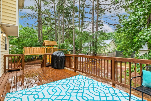 1984 Sadler Ave, Creedmoor, NC 27522 - deck with a grill and view of wooded area