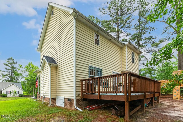 1984 Sadler Ave, Creedmoor, NC 27522 - rear view of house with a wooden deck, a lawn, and crawl space