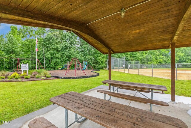 1984 Sadler Ave, Creedmoor, NC 27522 - view of community featuring a playground and view of wooded area
