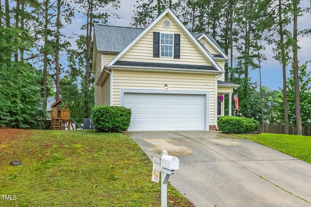 1984 Sadler Ave, Creedmoor, NC 27522 - traditional-style house featuring concrete driveway, central air condition unit, a garage, roof with shingles, and a playground