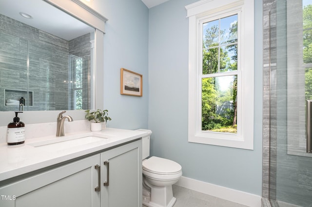 full bathroom with toilet, baseboards, and vanity