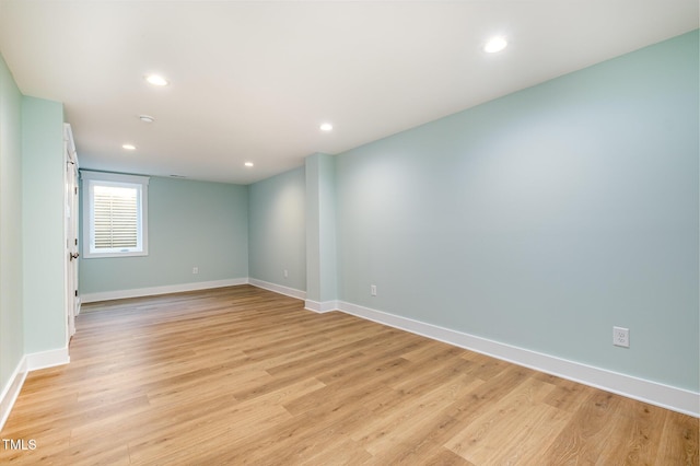 unfurnished room featuring recessed lighting, baseboards, and light wood-style floors