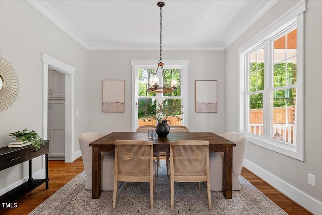 3932 Old Chapel Hill Rd, Durham, NC 27707 - dining space featuring crown molding, baseboards, and wood finished floors