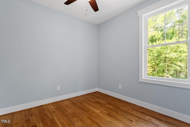 3932 Old Chapel Hill Rd, Durham, NC 27707 - spare room with a wealth of natural light, baseboards, a ceiling fan, and wood finished floors