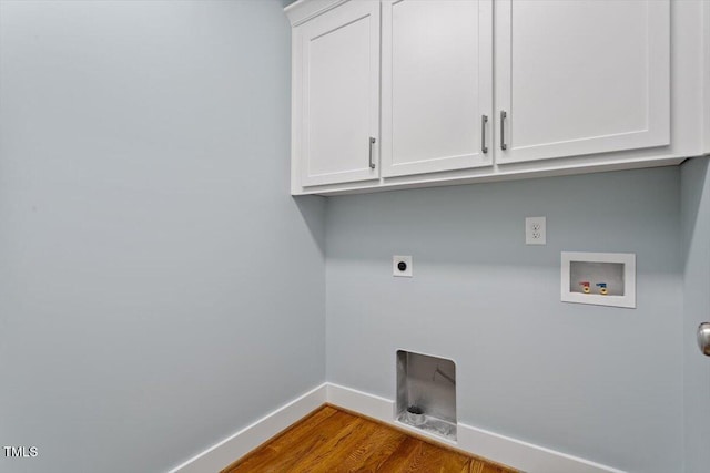 3932 Old Chapel Hill Rd, Durham, NC 27707 - clothes washing area featuring wood finished floors, electric dryer hookup, cabinet space, hookup for a washing machine, and baseboards