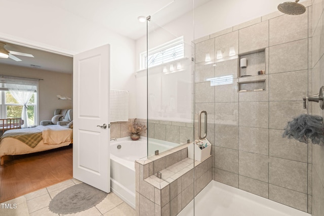 2404 Azalea Dr, Durham, NC 27703 - ensuite bathroom featuring a shower stall, tile patterned floors, a bath, and a ceiling fan
