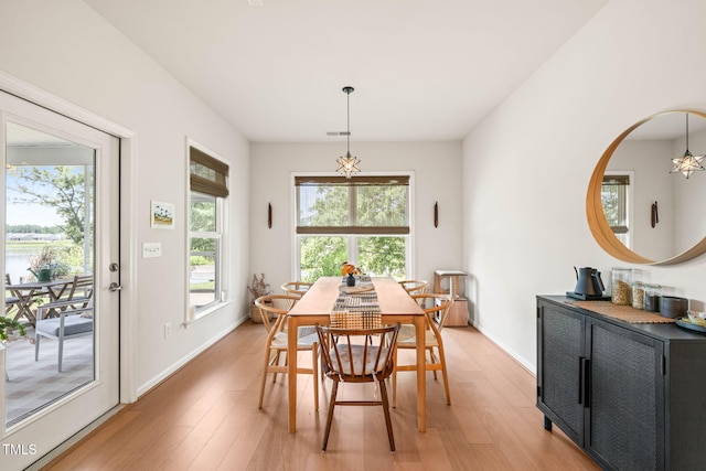 2404 Azalea Dr, Durham, NC 27703 - dining space with plenty of natural light, light wood-style flooring, and baseboards