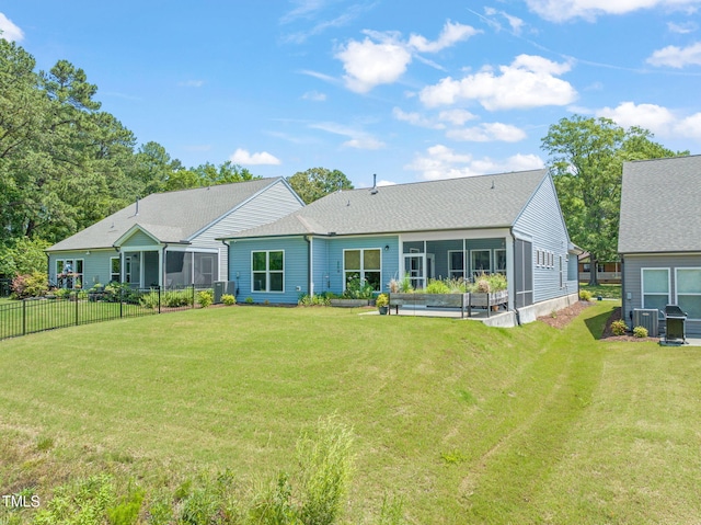 2404 Azalea Dr, Durham, NC 27703 - back of property featuring a sunroom and central AC