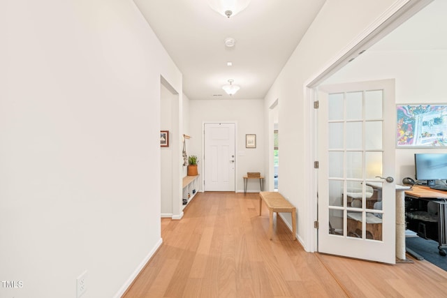 2404 Azalea Dr, Durham, NC 27703 - hall featuring light wood finished floors, an office area, and baseboards
