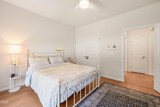 2404 Azalea Dr, Durham, NC 27703 - bedroom with wood finished floors, a closet, baseboards, and a ceiling fan