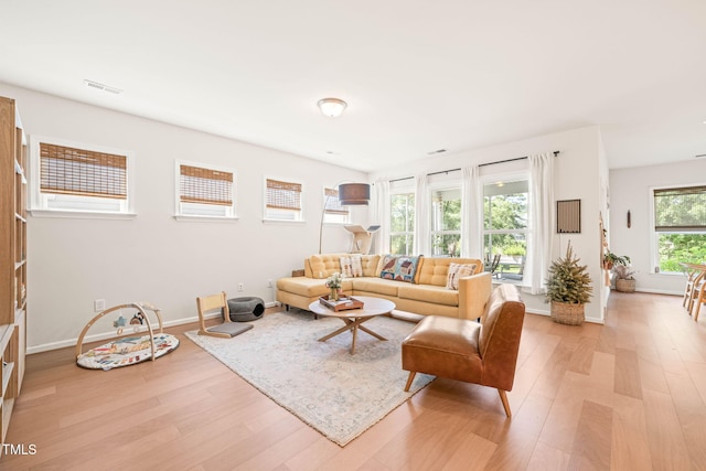 2404 Azalea Dr, Durham, NC 27703 - living room with light wood-style flooring and baseboards