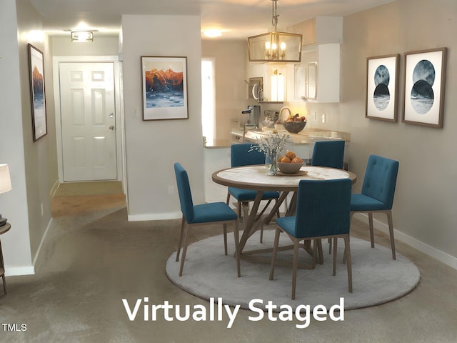 dining space featuring baseboards and a notable chandelier