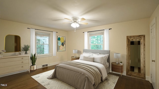 409 Green St, Sanford, NC 27330 - bedroom with dark wood-type flooring, baseboards, and a ceiling fan