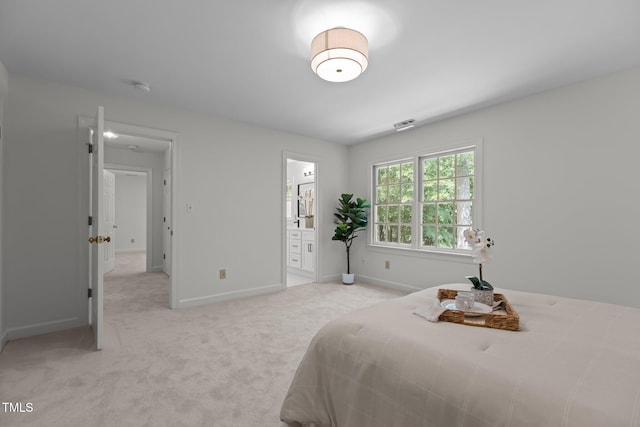 128 Cobblestone Dr, Chapel Hill, NC 27516 - bedroom with light carpet, baseboards, and ensuite bath