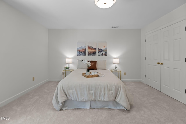 128 Cobblestone Dr, Chapel Hill, NC 27516 - bedroom featuring light carpet, baseboards, and a closet