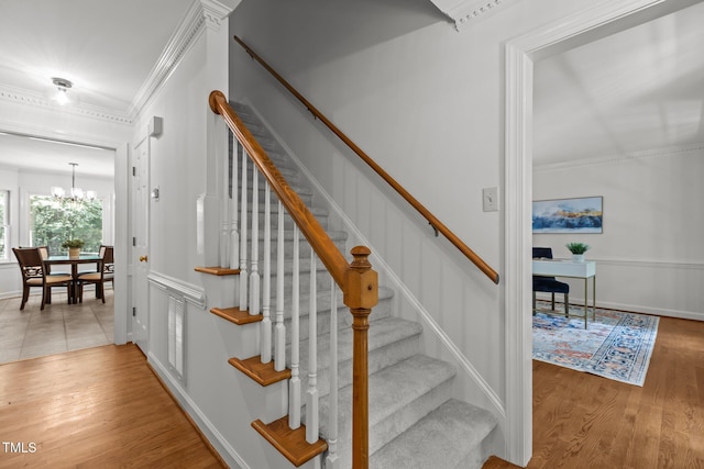 128 Cobblestone Dr, Chapel Hill, NC 27516 - stairs with wood finished floors, a chandelier, crown molding, and baseboards