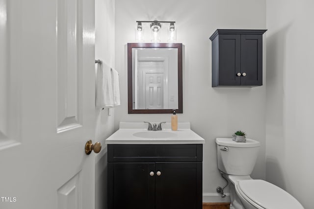 128 Cobblestone Dr, Chapel Hill, NC 27516 - half bath with toilet, vanity, and baseboards