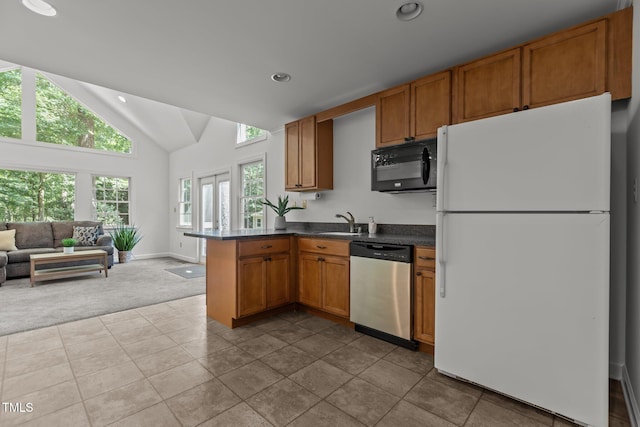 128 Cobblestone Dr, Chapel Hill, NC 27516 - kitchen featuring freestanding refrigerator, stainless steel dishwasher, black microwave, carpet floors, and a sink
