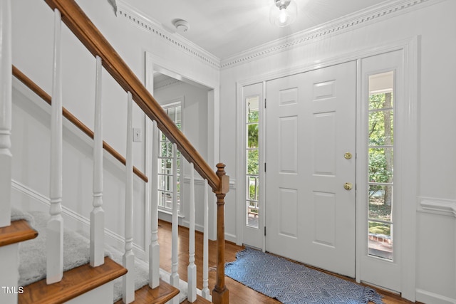 128 Cobblestone Dr, Chapel Hill, NC 27516 - entryway with stairway, wood finished floors, and crown molding