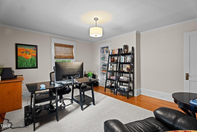 office area with crown molding, baseboards, and wood finished floors