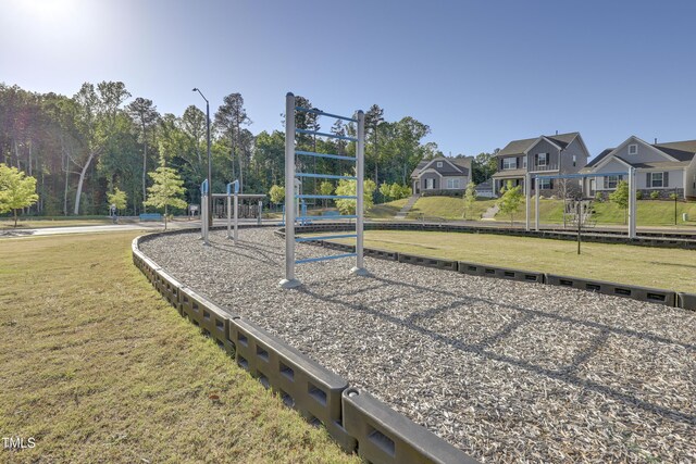 view of jungle gym with a lawn and a residential view