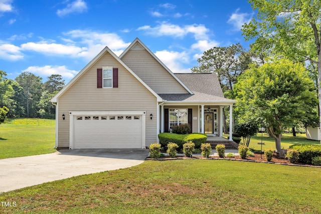 traditional home with covered porch, roof with shingles, driveway, and a front yard