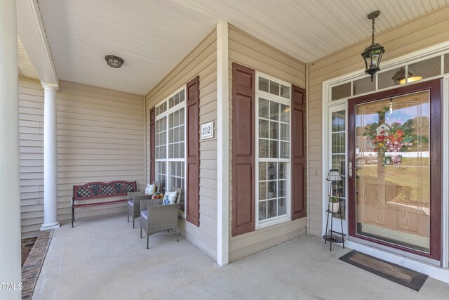 doorway to property featuring covered porch